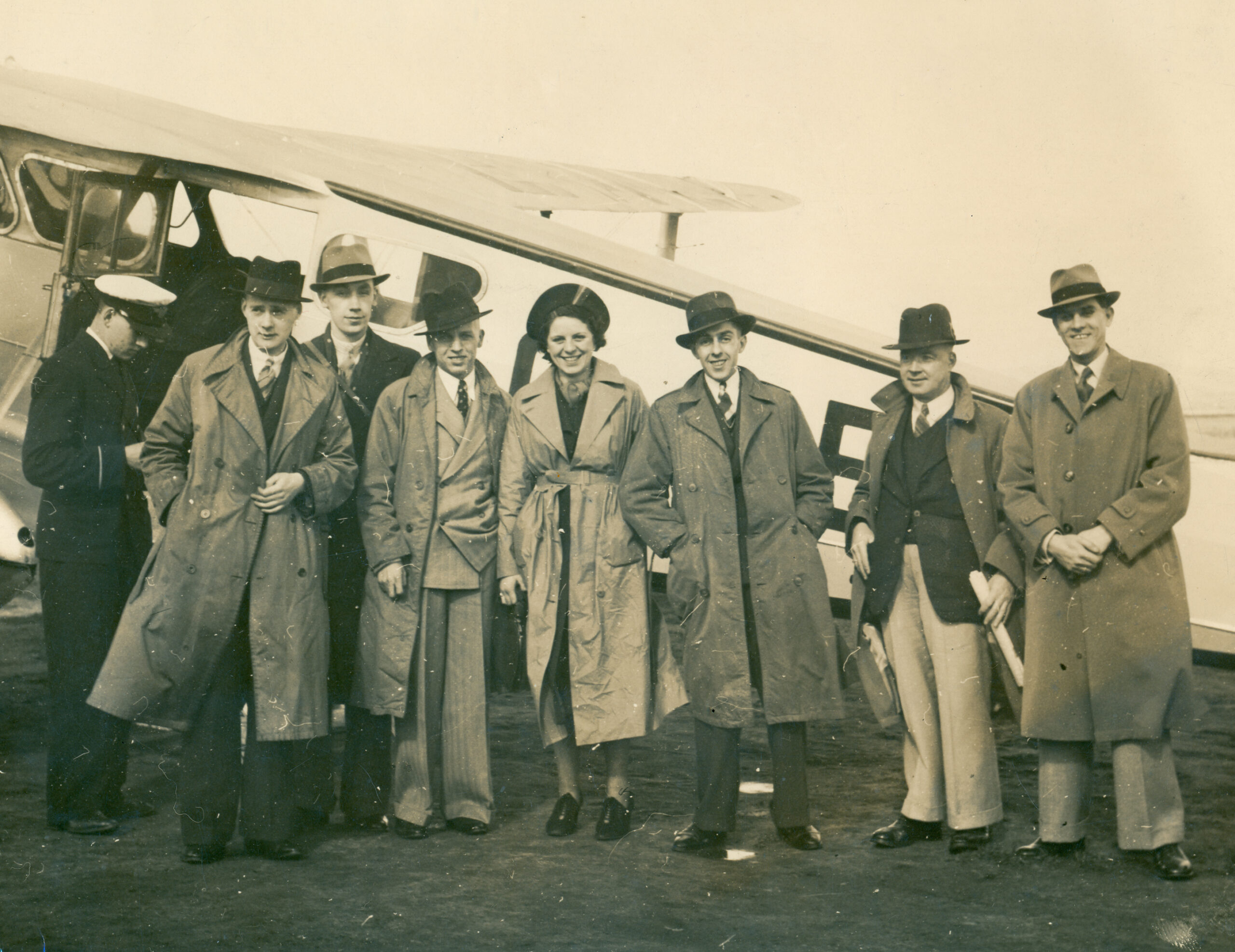 Photograph of passengers about to board a de Havilland Dragon Rapide in 1938 - 2019 scan of the photo before repair