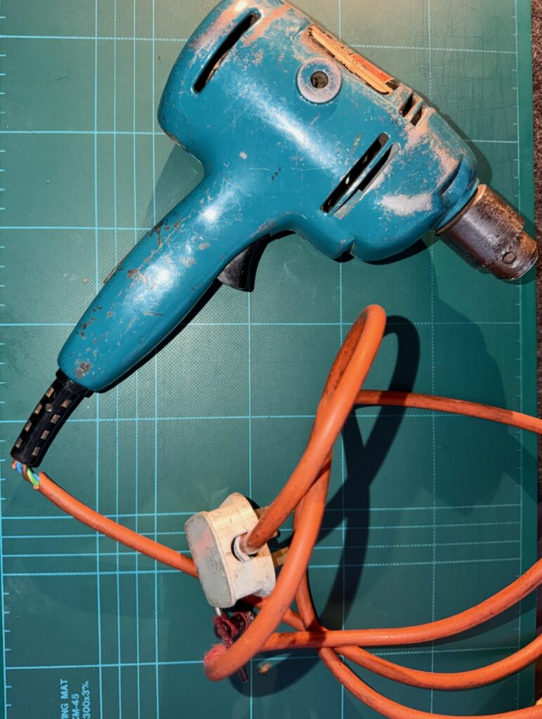 Black and Decker Super D500 drill, with broken outer insulation of the mains power cable.