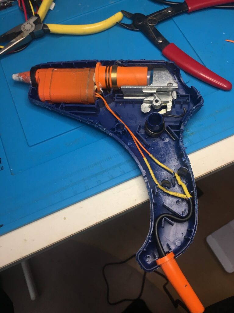 Inside a hot glue gun from the 1980's following mains cable replacement.