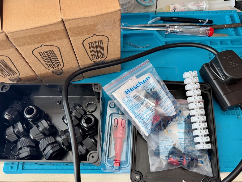 Dim bulb / light limiter components: Incandescent light bulbs, a junction box, switches, connection strip, and 1 metre single gang mains extention.