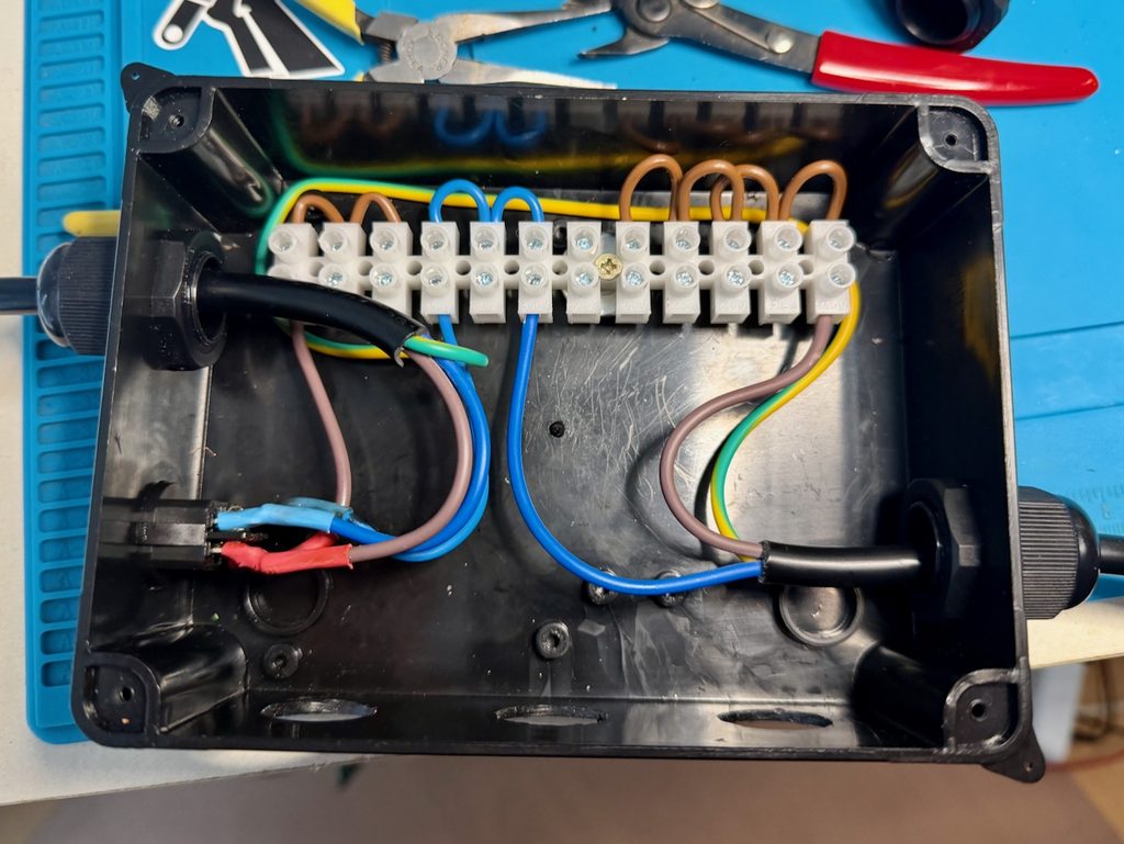 Incoming and outgoing wiring connected up.